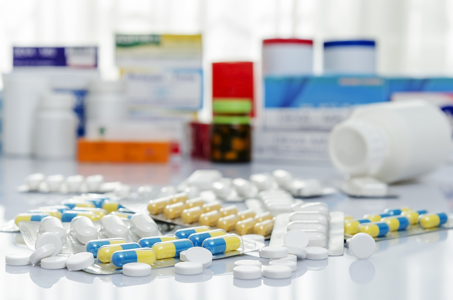 Variety of medicines and drugs on table