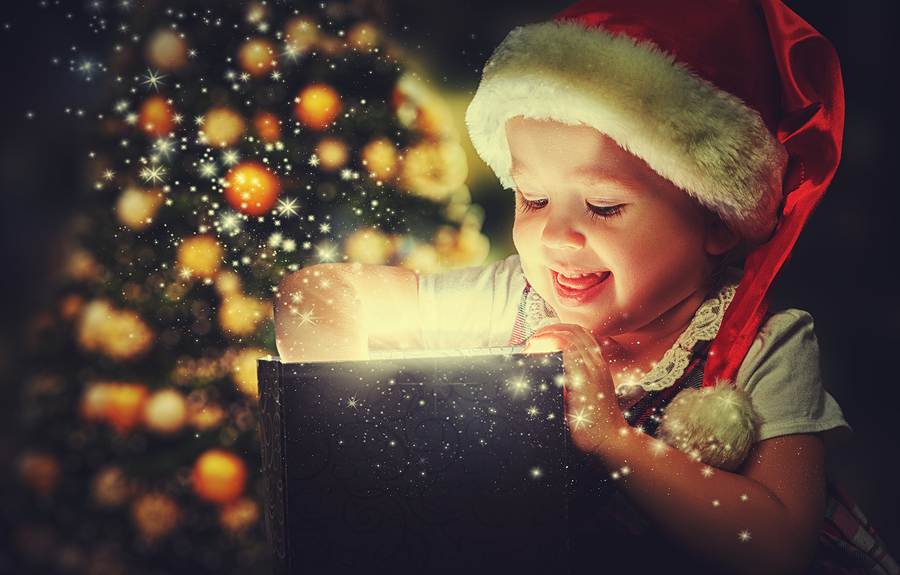 Christmas miracle magic gift box and a child baby girl