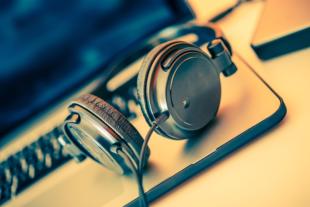 Headphones on Laptop Computer. Online Music Listening. Music Concept. ** Note: Shallow depth of field