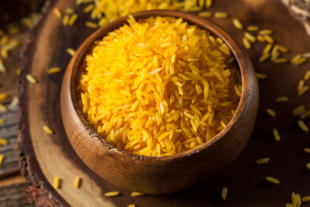 Raw Organic Yellow Saffron Rice in a Bowl