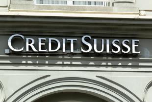 INTERLAKEN, SWITZERLAND - JUNE 5, 2016: Credit Suisse signboard over entrance of Credit Suisse office. Credit Suisse Group is a Swiss multinational financial services holding company, headquartered in Zurich, that operates the Credit Suisse Bank and other