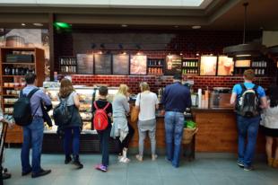 DUBAI, UAE - JUNE 23, 2015: Starbucks cafe interior. Starbucks Corporation, doing business as Starbucks Coffee, is an American global coffee company and coffeehouse chain based in Seattle, Washington